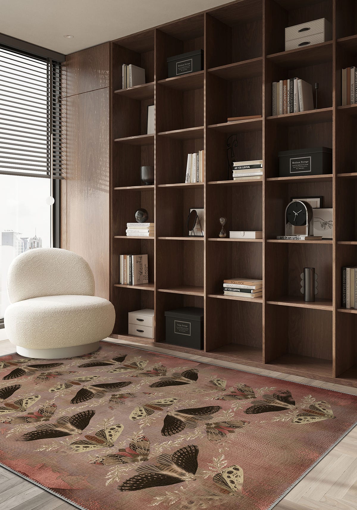 Modern living room with a large bookshelf, decorative rug, and armchair.