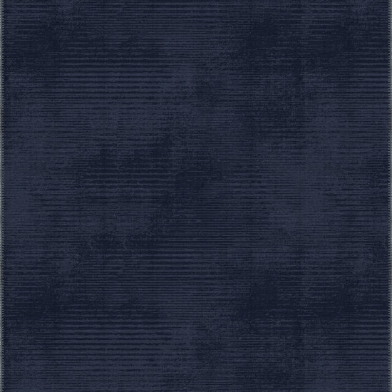 Navy blue rug with a subtle pattern in midnight blue tones.